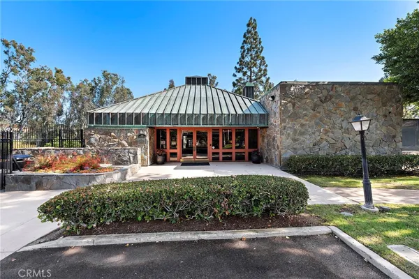 a view of a house with swimming pool and sitting area