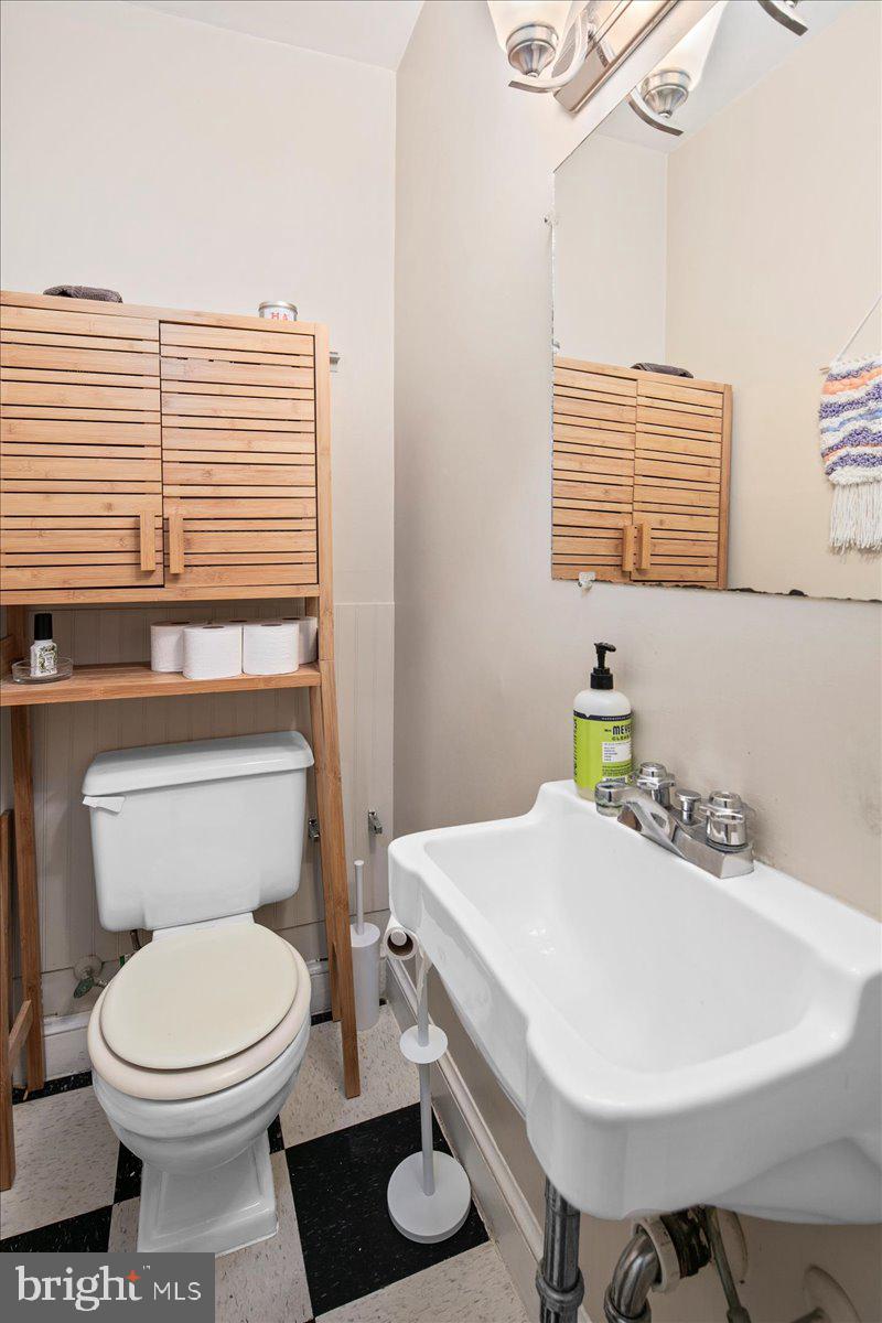 304 2nd Street Southeast Washington, DC 20003 - Photo 16 of 70 a bathroom with a sink a toilet and a window