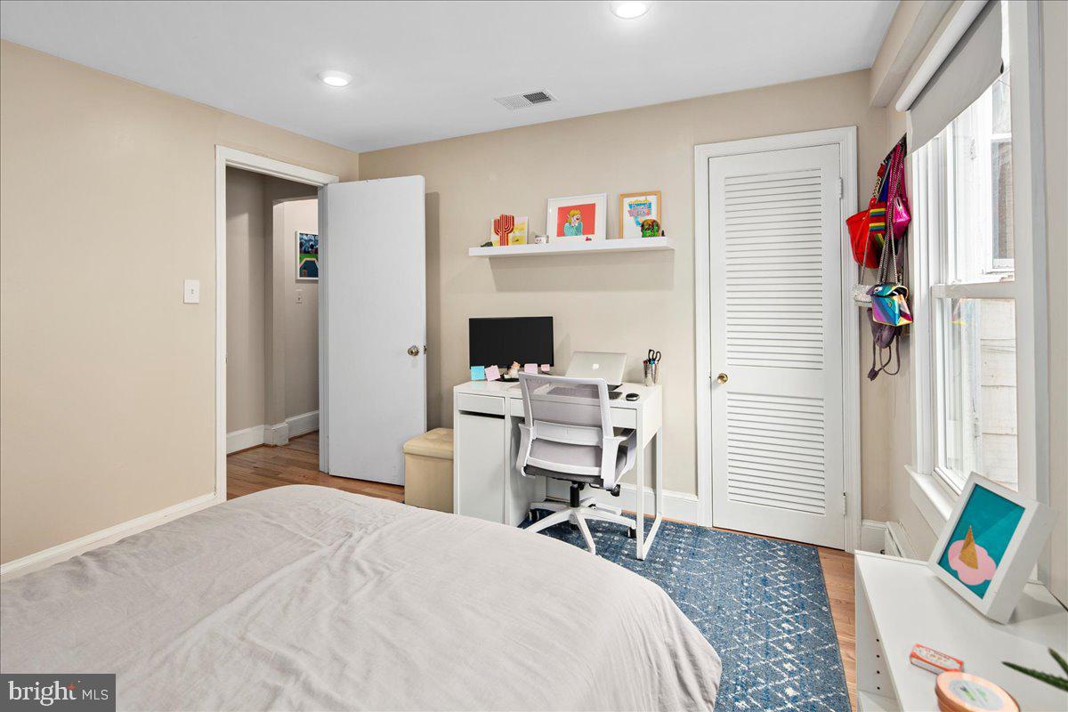 304 2nd Street Southeast Washington, DC 20003 - Photo 18 of 70 a bedroom with a bed and a desk