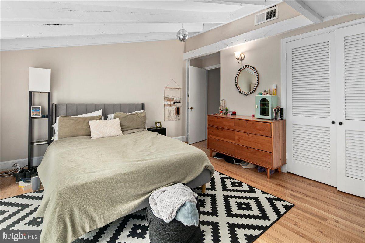 304 2nd Street Southeast Washington, DC 20003 - Photo 20 of 70 a bedroom with bed and wooden floor