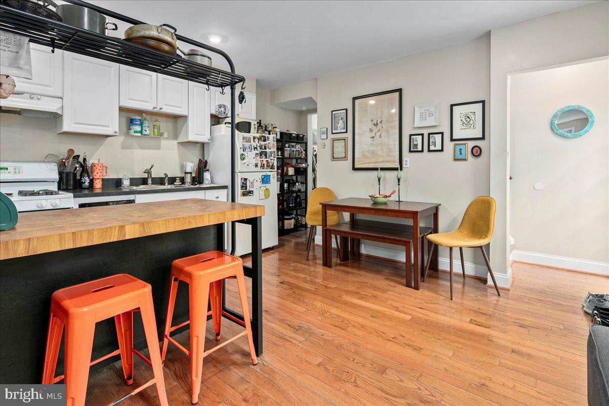 304 2nd Street Southeast Washington, DC 20003 - Photo 2 of 70 a living room with stainless steel appliances furniture and a kitchen view