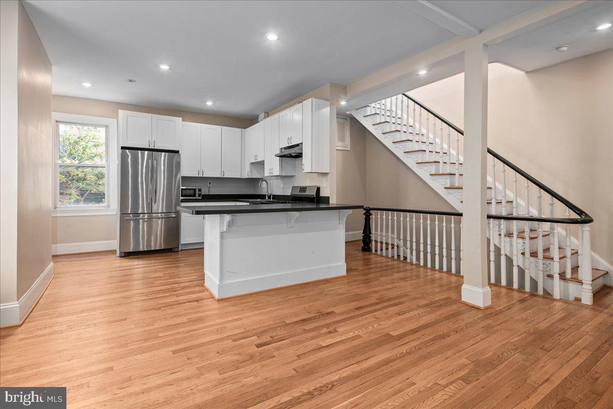 304 2nd Street Southeast Washington, DC 20003 - Photo 26 of 70 a kitchen with stainless steel appliances granite countertop a refrigerator and a stove top oven
