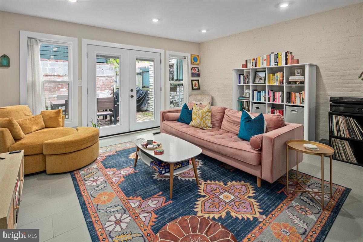 304 2nd Street Southeast Washington, DC 20003 - Photo 3 of 70 a living room with furniture and a book shelf