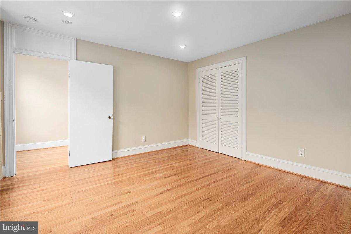 304 2nd Street Southeast Washington, DC 20003 - Photo 53 of 70 a view of an empty room with wooden floor and a window