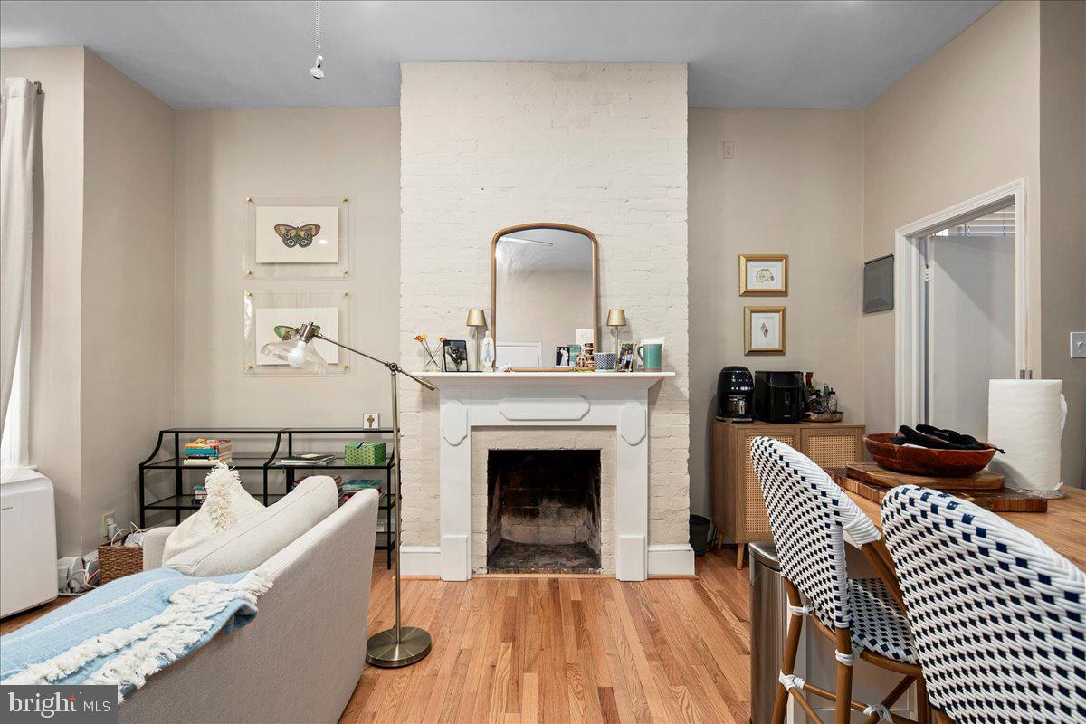 304 2nd Street Southeast Washington, DC 20003 - Photo 55 of 70 a living room with furniture and a fireplace