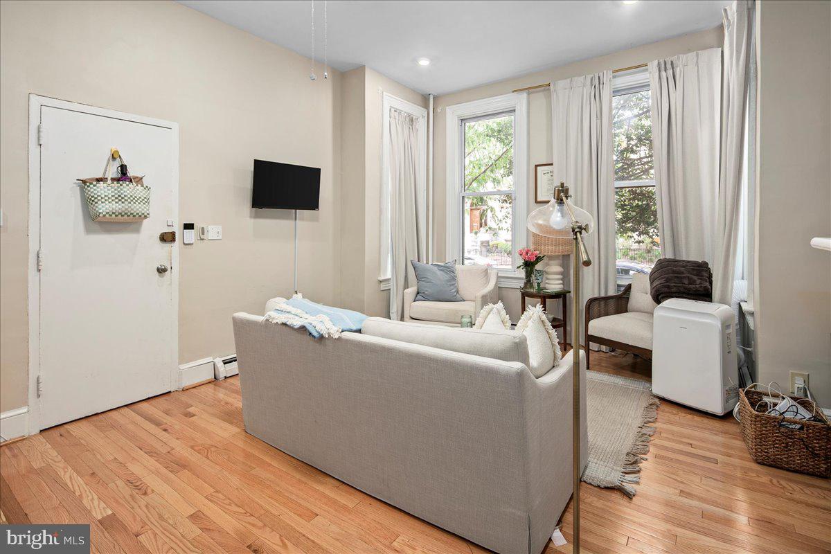 304 2nd Street Southeast Washington, DC 20003 - Photo 56 of 70 a living room with furniture and a flat screen tv