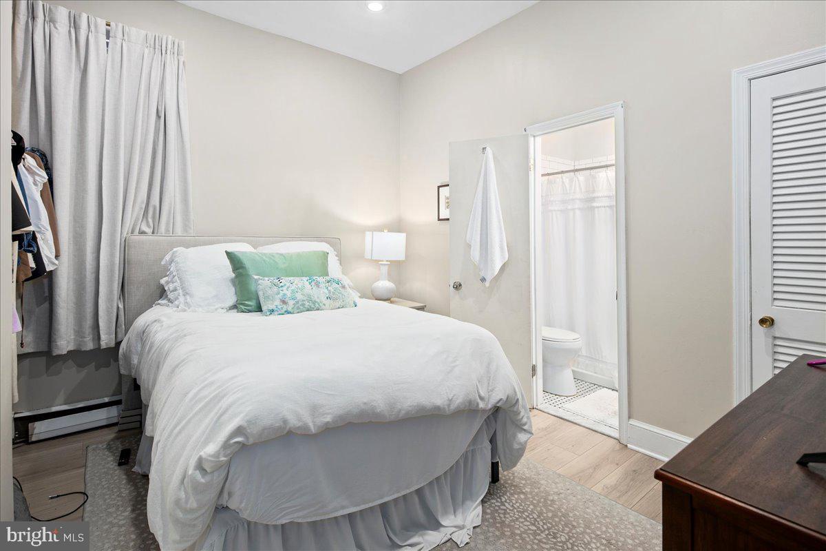 304 2nd Street Southeast Washington, DC 20003 - Photo 65 of 70 a bedroom with a bed and a window