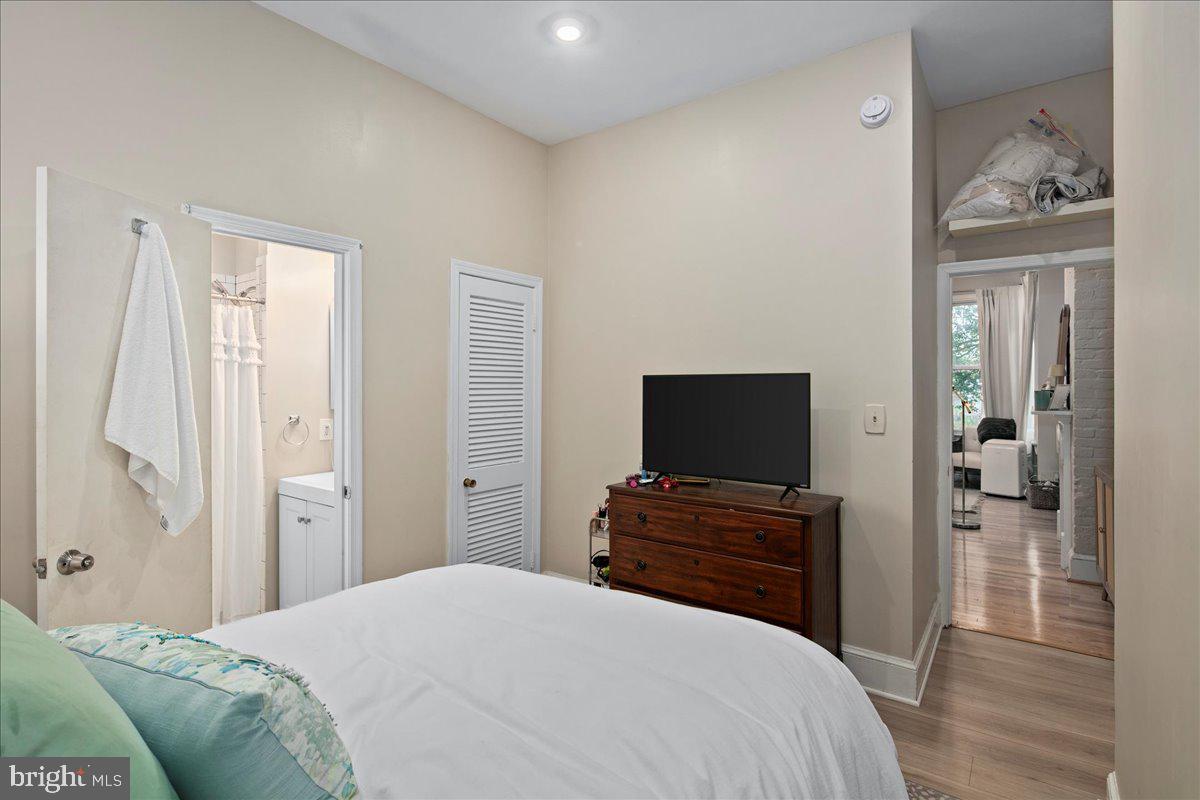 304 2nd Street Southeast Washington, DC 20003 - Photo 66 of 70 a bedroom with a bed and a flat screen tv