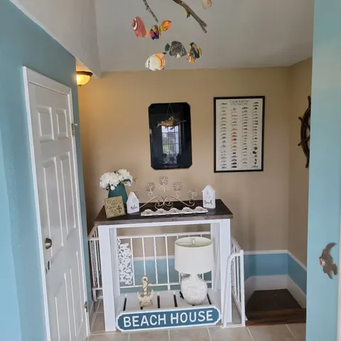 a view of an entryway with wooden floor