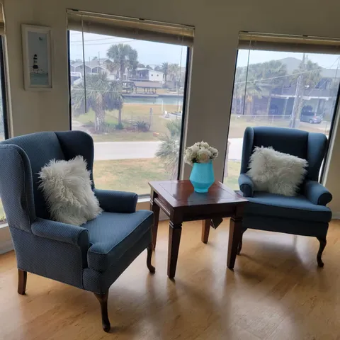 a living room with furniture and a large window