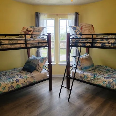 a bedroom with a bed and window