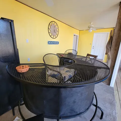 a outdoor space with patio the couches and a dining table with garden view