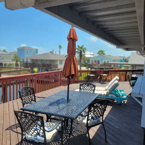 a view of balcony with furniture and wooden deck