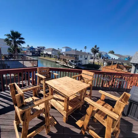 a terrace with outdoor seating and city view