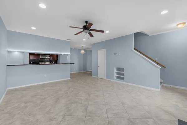 a view of a kitchen with furniture and an empty space