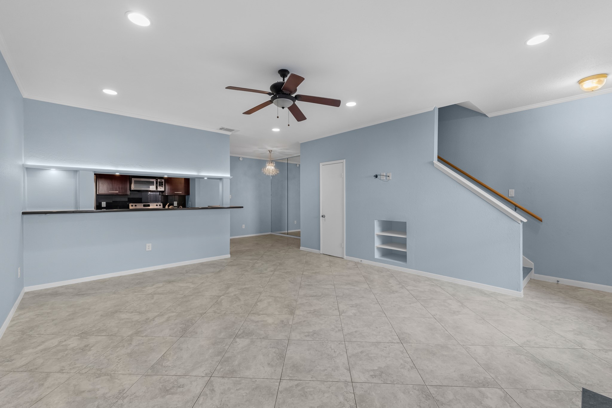 9800 Pagewood Lane, Unit 3103 Houston, TX 77063 - Photo 13 of 27 a view of a kitchen with furniture and an empty space