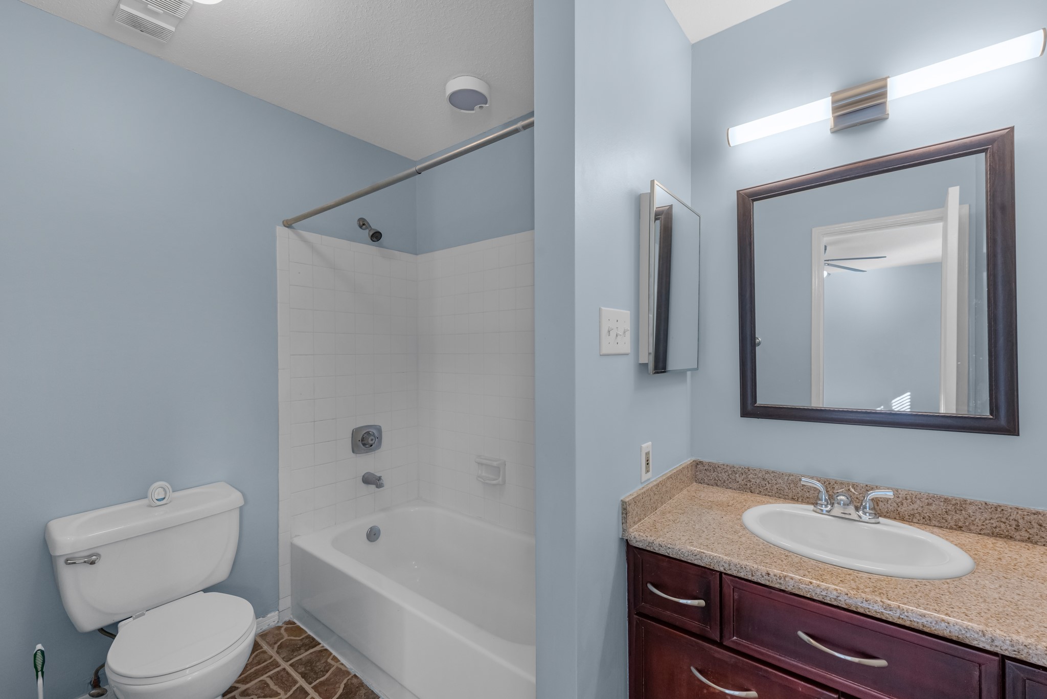 9800 Pagewood Lane, Unit 3103 Houston, TX 77063 - Photo 16 of 27 a bathroom with a granite countertop sink toilet and shower