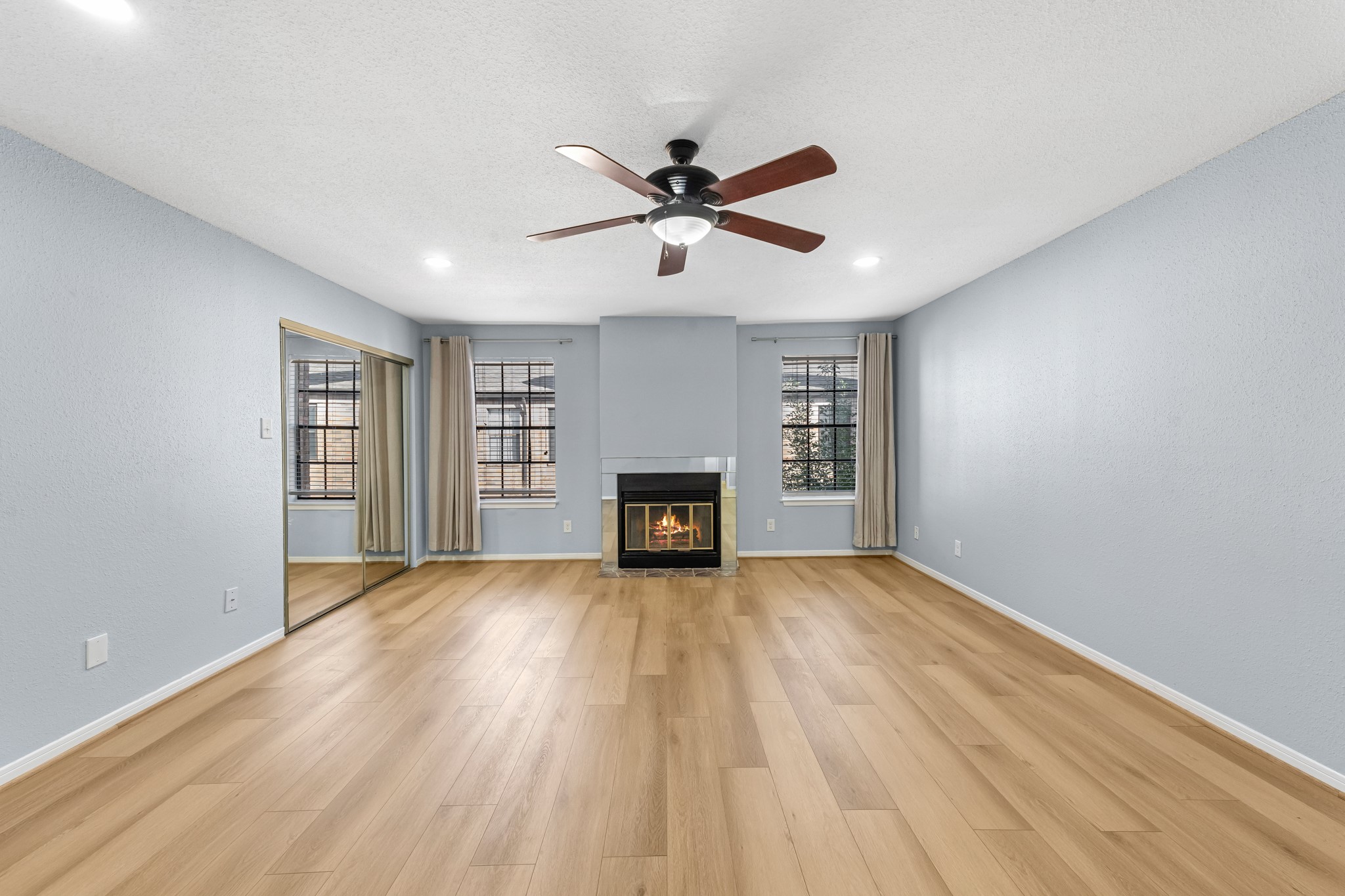 9800 Pagewood Lane, Unit 3103 Houston, TX 77063 - Photo 18 of 27 a view of a room window and wooden floor