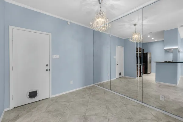 a view of a kitchen with a sink and a chandelier