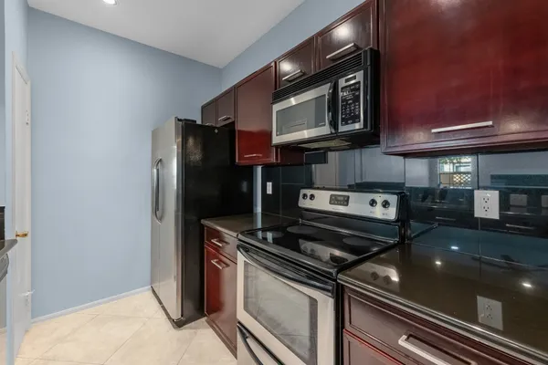 a kitchen with a stove microwave and sink