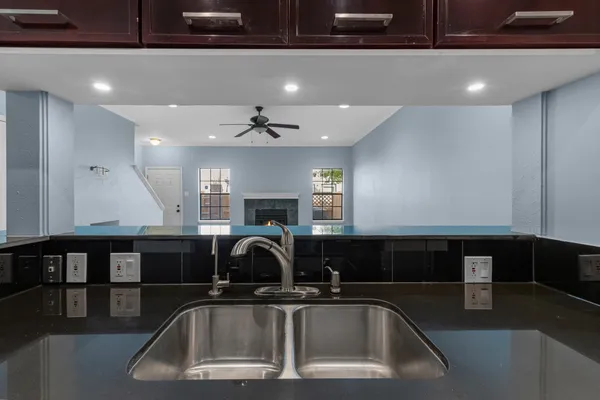 a kitchen with a sink and a refrigerator