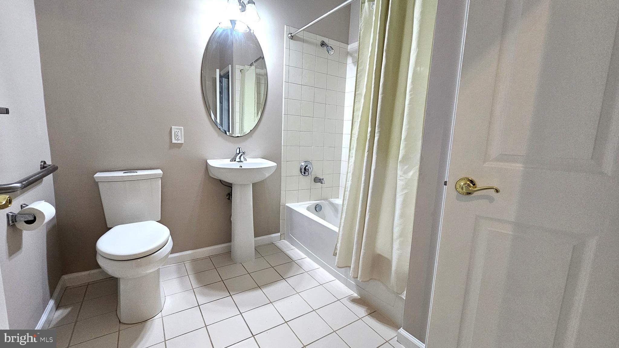 1121 Colts Circle, Unit P Lawrenceville, NJ 08648 - Photo 12 of 34 a bathroom with a toilet sink and mirror