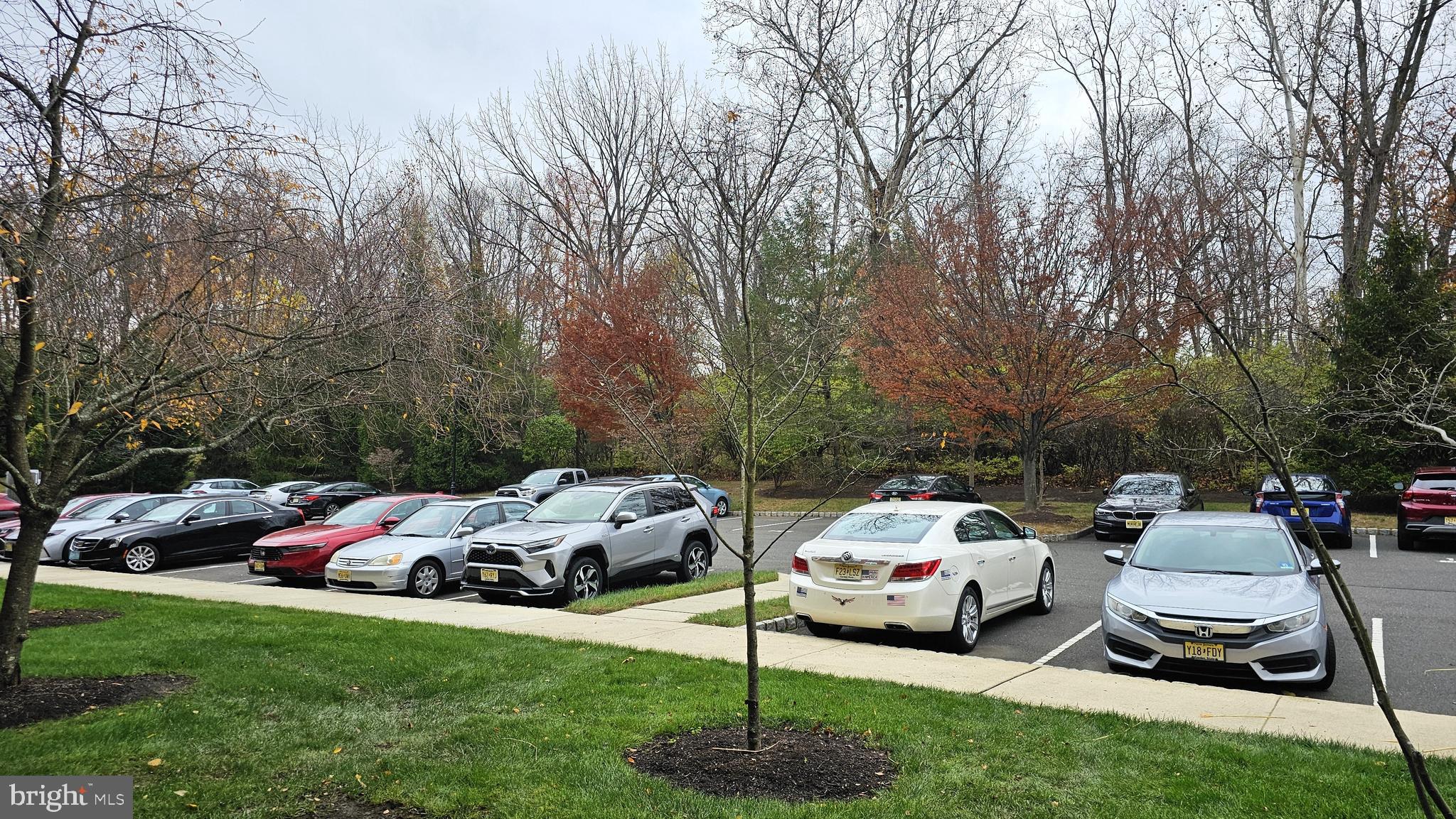 1121 Colts Circle, Unit P Lawrenceville, NJ 08648 - Photo 21 of 34 a car parked in front of a white house