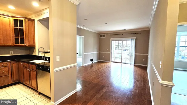 a kitchen with stainless steel appliances granite countertop a stove and a refrigerator
