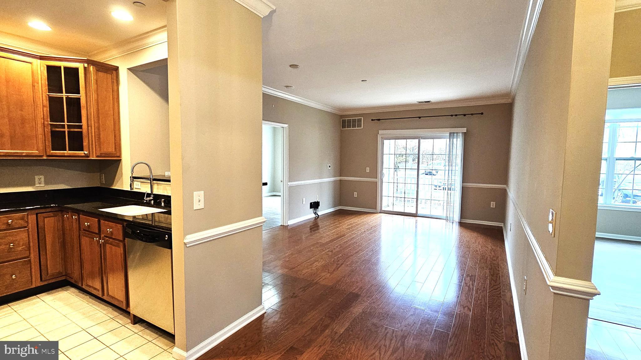1121 Colts Circle, Unit P Lawrenceville, NJ 08648 - Photo 3 of 34 a kitchen with stainless steel appliances granite countertop a stove and a refrigerator