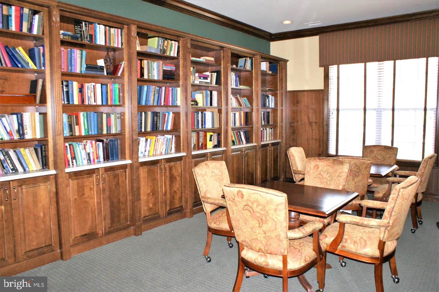 1121 Colts Circle, Unit P Lawrenceville, NJ 08648 - Photo 31 of 34 a view of a workspace with furniture and a bookshelf