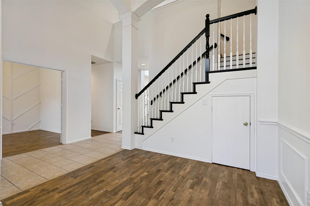 4107 Waverly Road Corinth, TX 76208 - Photo 3 of 30 Flanking the entry hall are the private office and this flexible space. The door underneath the stairs opens to a large storage closet.
