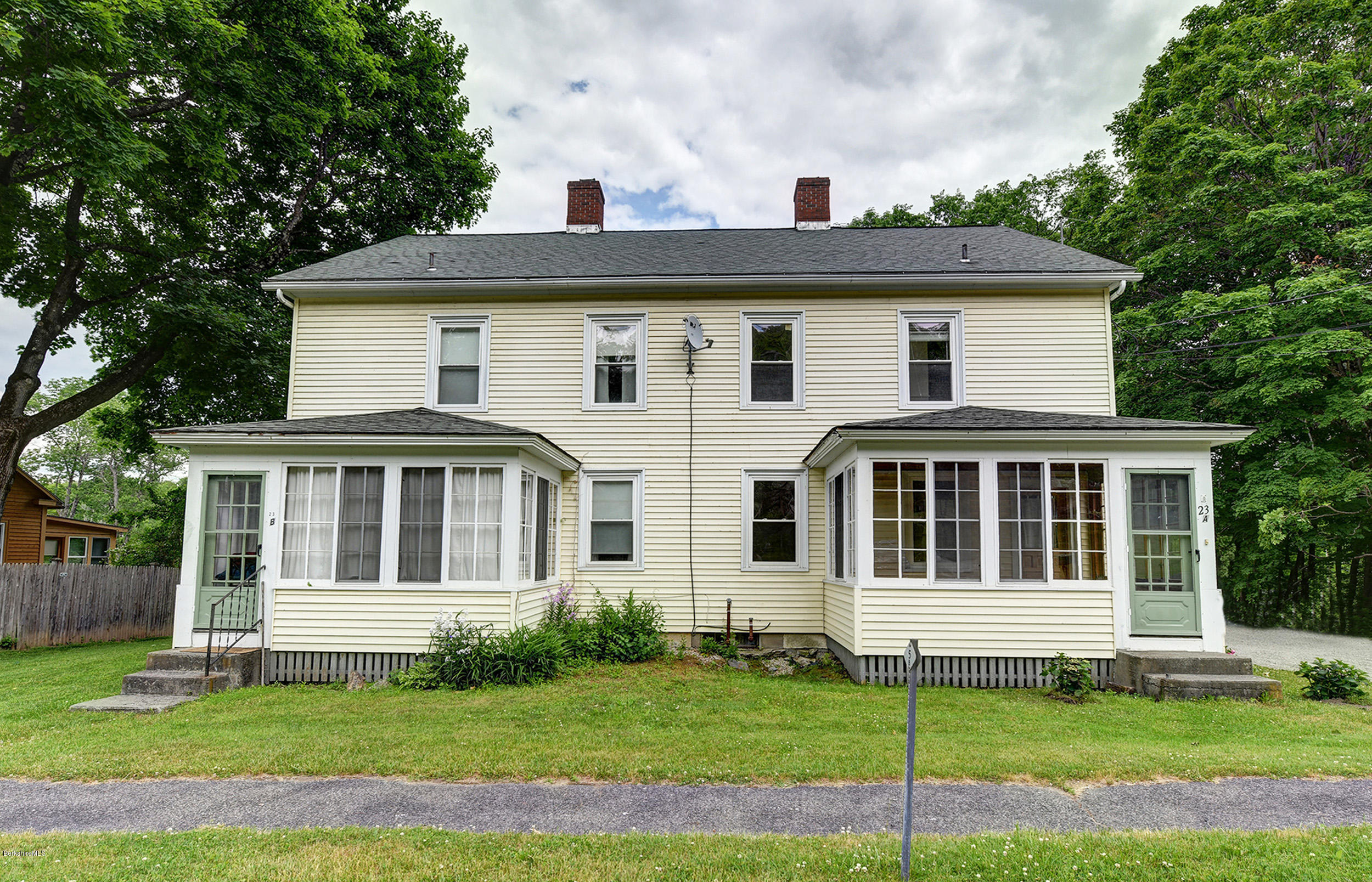23 Glendale Road Stockbridge, MA 01262 - Photo 2 of 30 a view of a white house with a big yard and potted plants