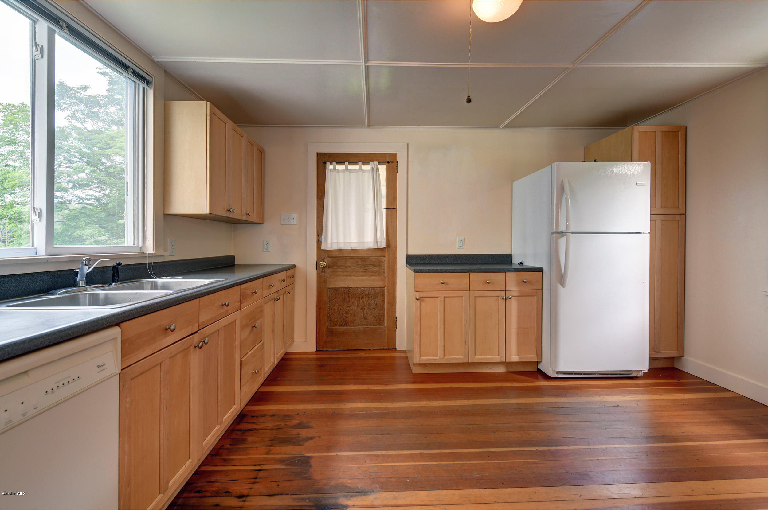 23 Glendale Road Stockbridge, MA 01262 - Photo 13 of 30 a kitchen with a refrigerator and window