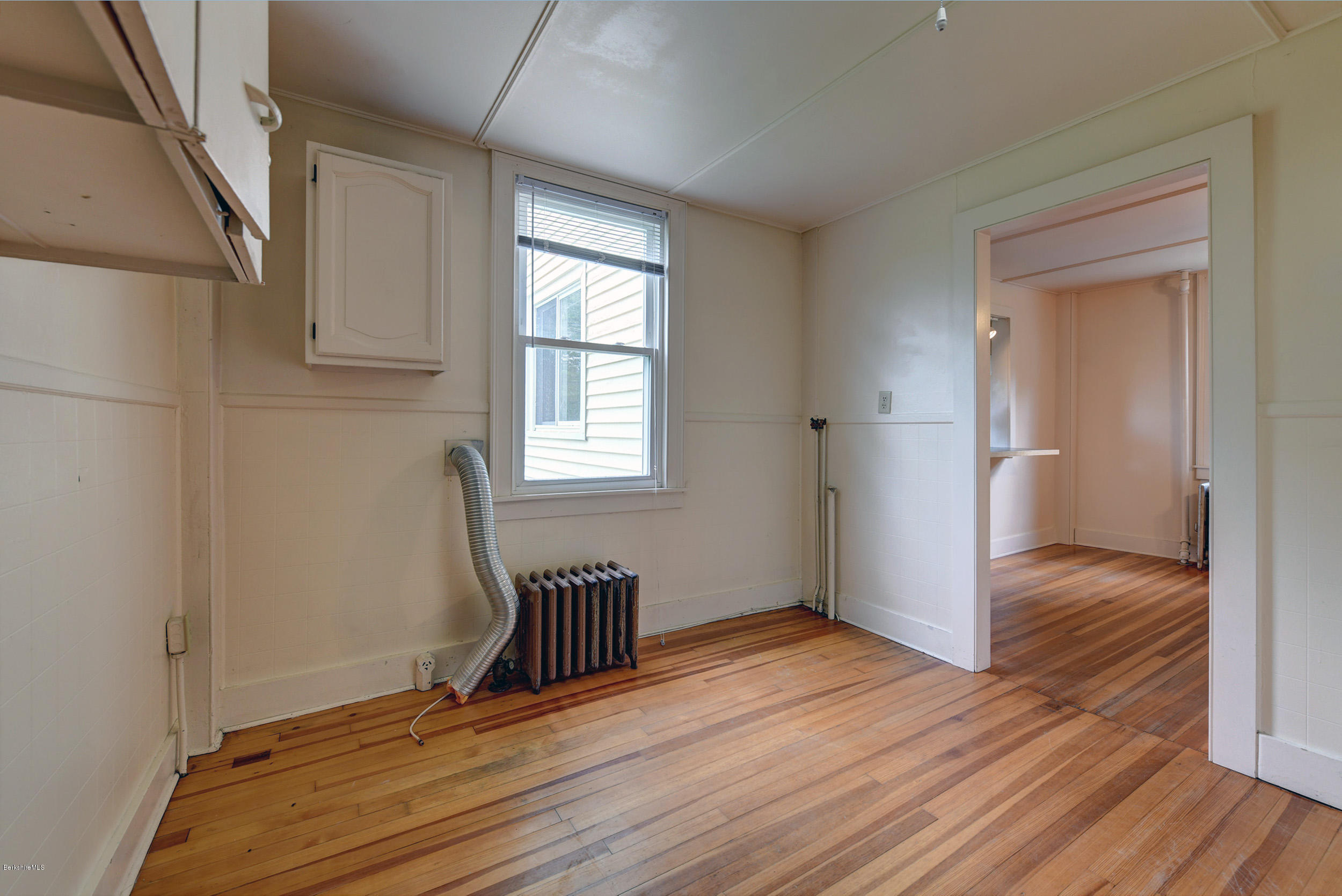 23 Glendale Road Stockbridge, MA 01262 - Photo 15 of 30 a view of an empty room with wooden floor and a window