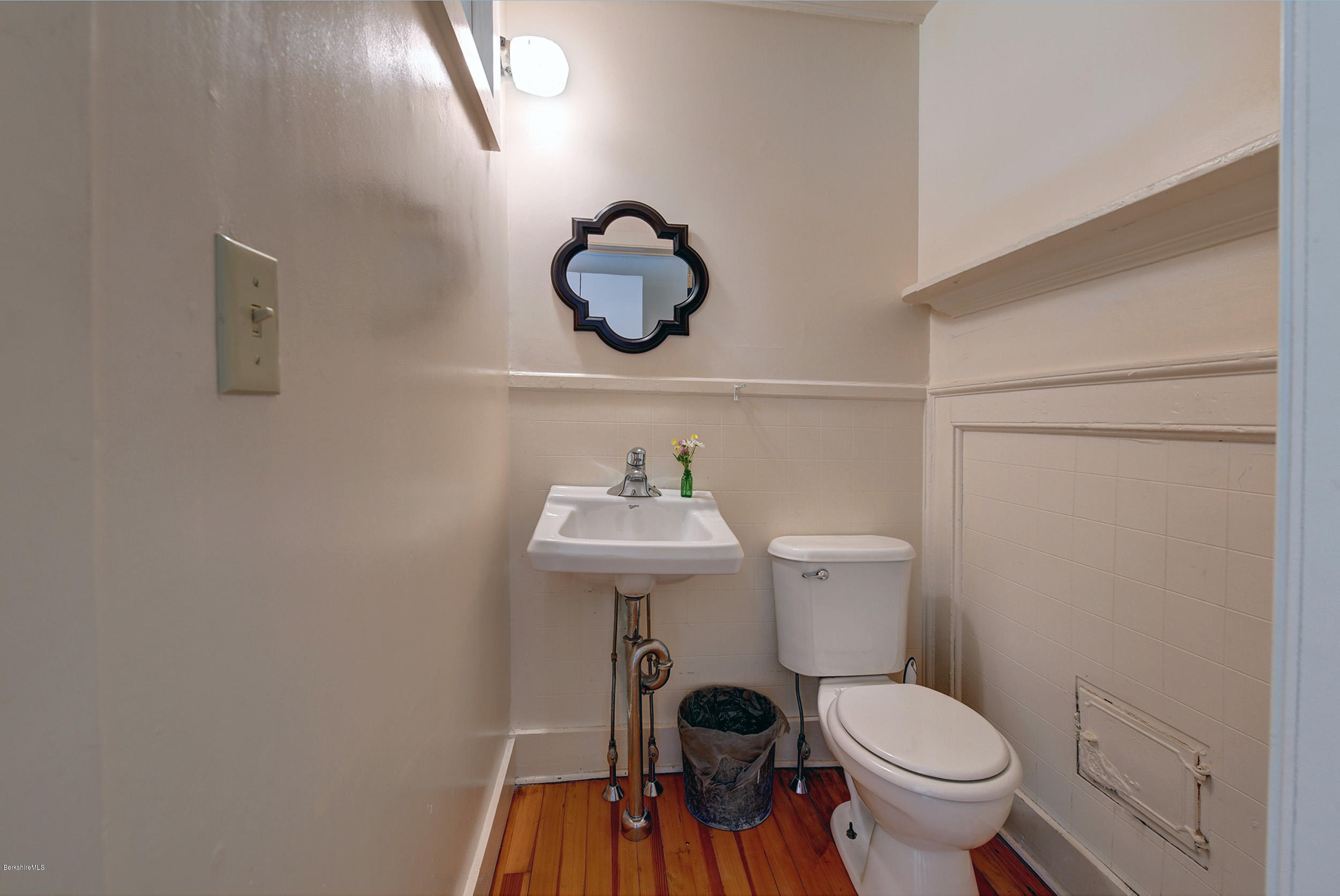 23 Glendale Road Stockbridge, MA 01262 - Photo 17 of 30 a bathroom with a toilet a sink and mirror