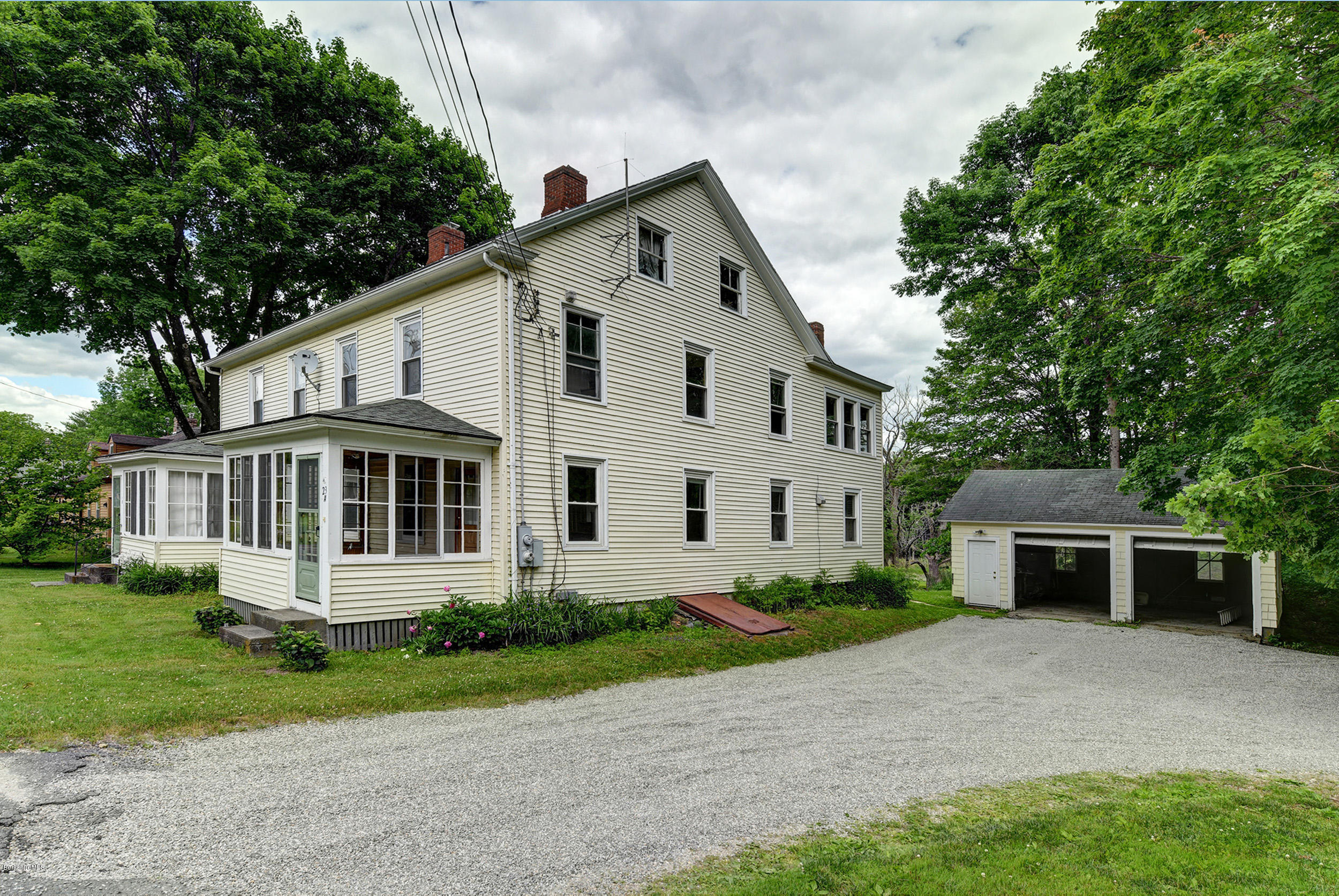 23 Glendale Road Stockbridge, MA 01262 - Photo 3 of 30 a front view of a house with a yard and trees