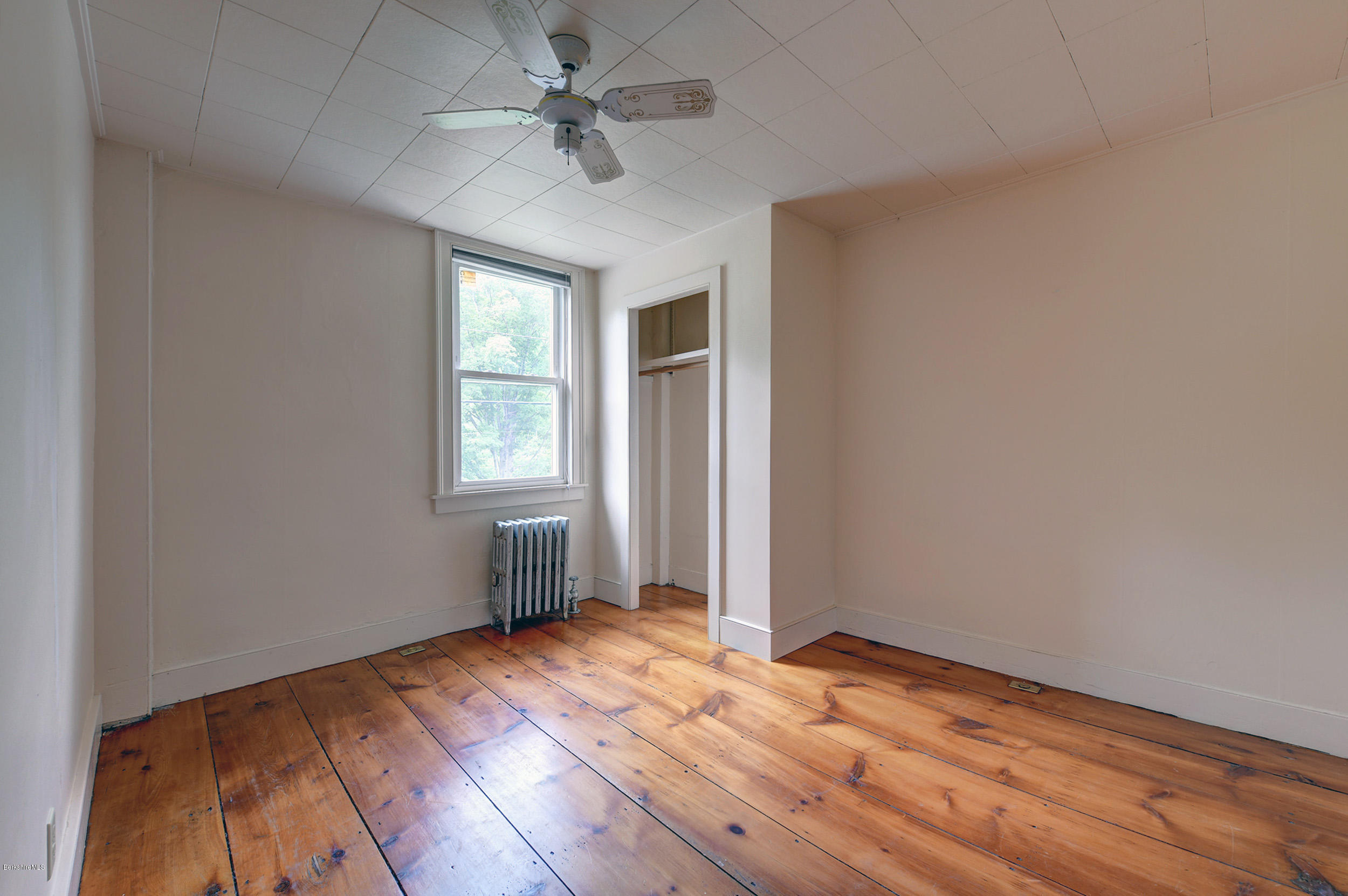 23 Glendale Road Stockbridge, MA 01262 - Photo 23 of 30 an empty room with wooden floor and windows