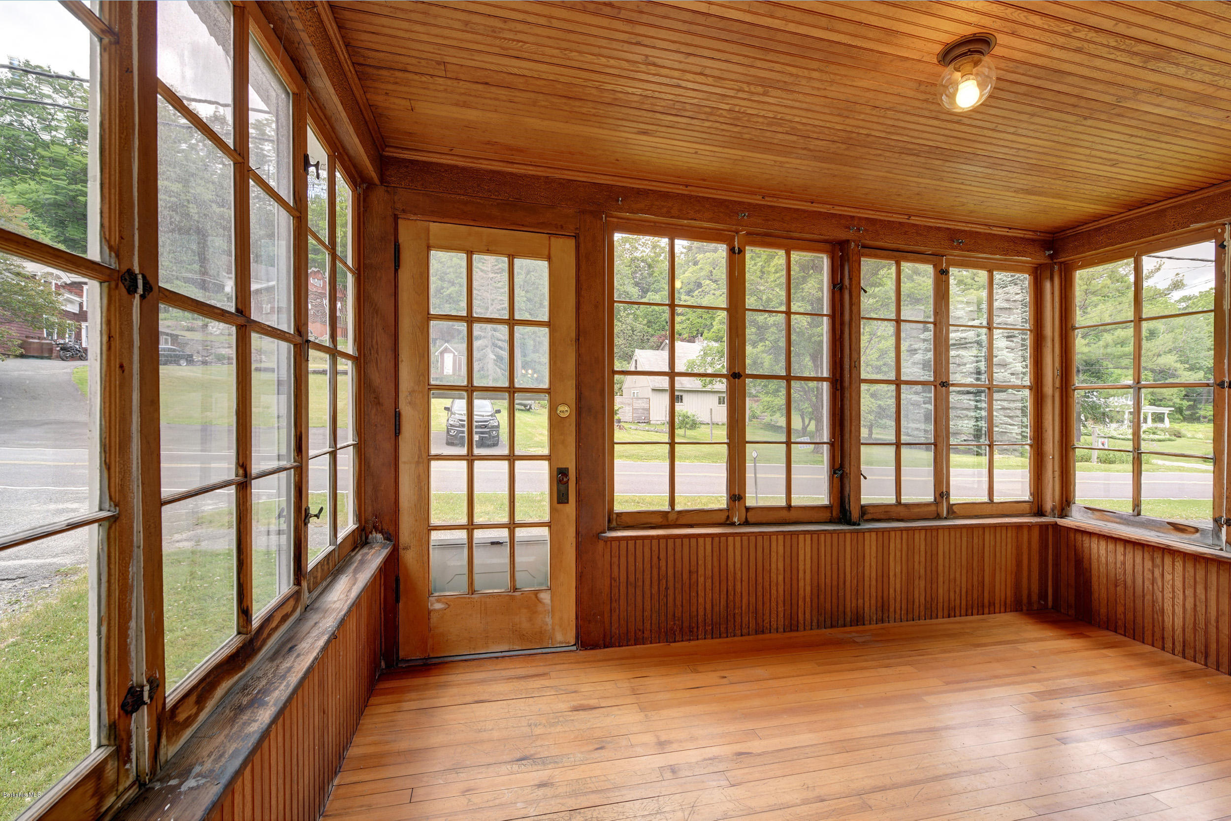 23 Glendale Road Stockbridge, MA 01262 - Photo 4 of 30 a view of an empty room with wooden floor and a window