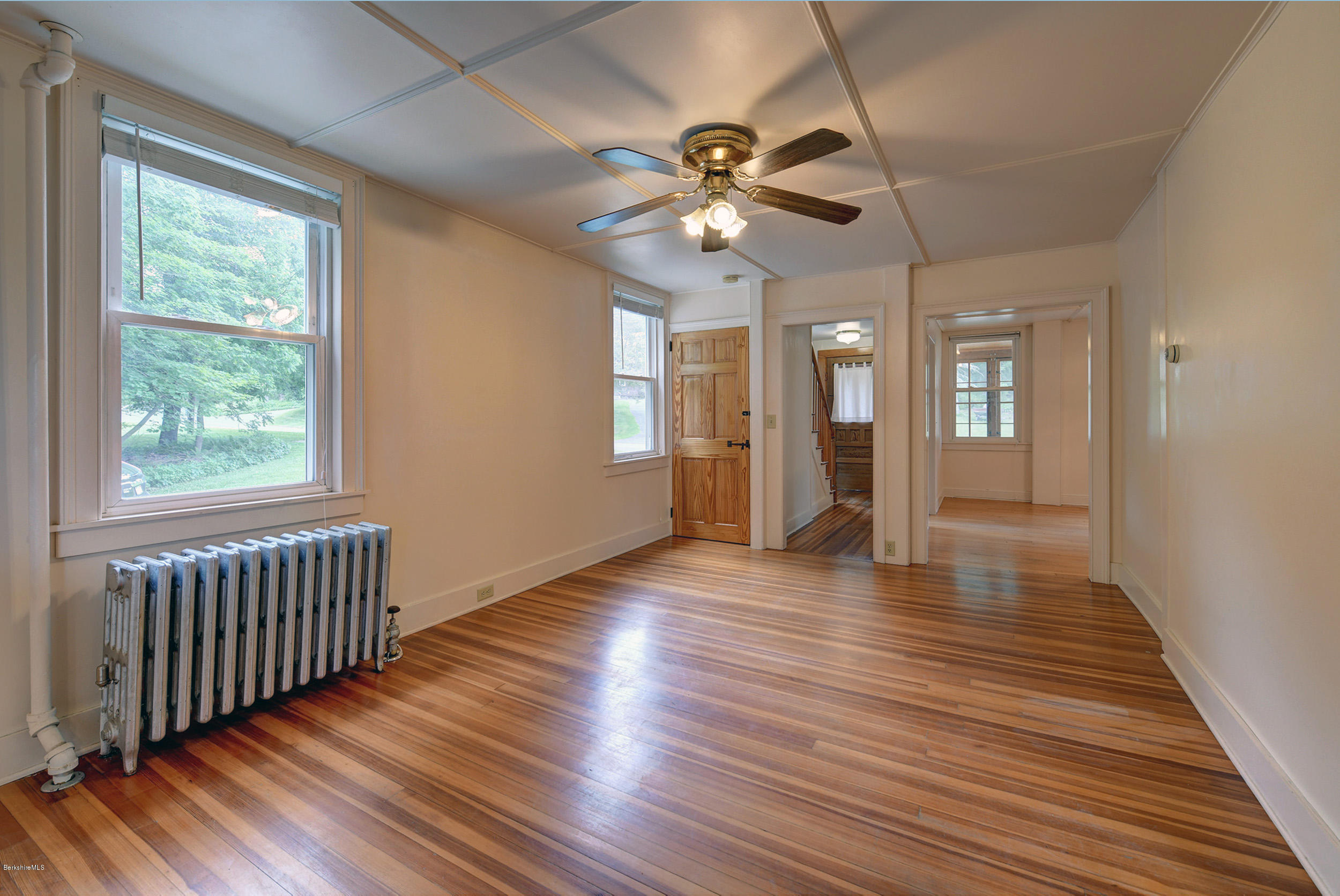 23 Glendale Road Stockbridge, MA 01262 - Photo 9 of 30 an empty room with wooden floor and windows