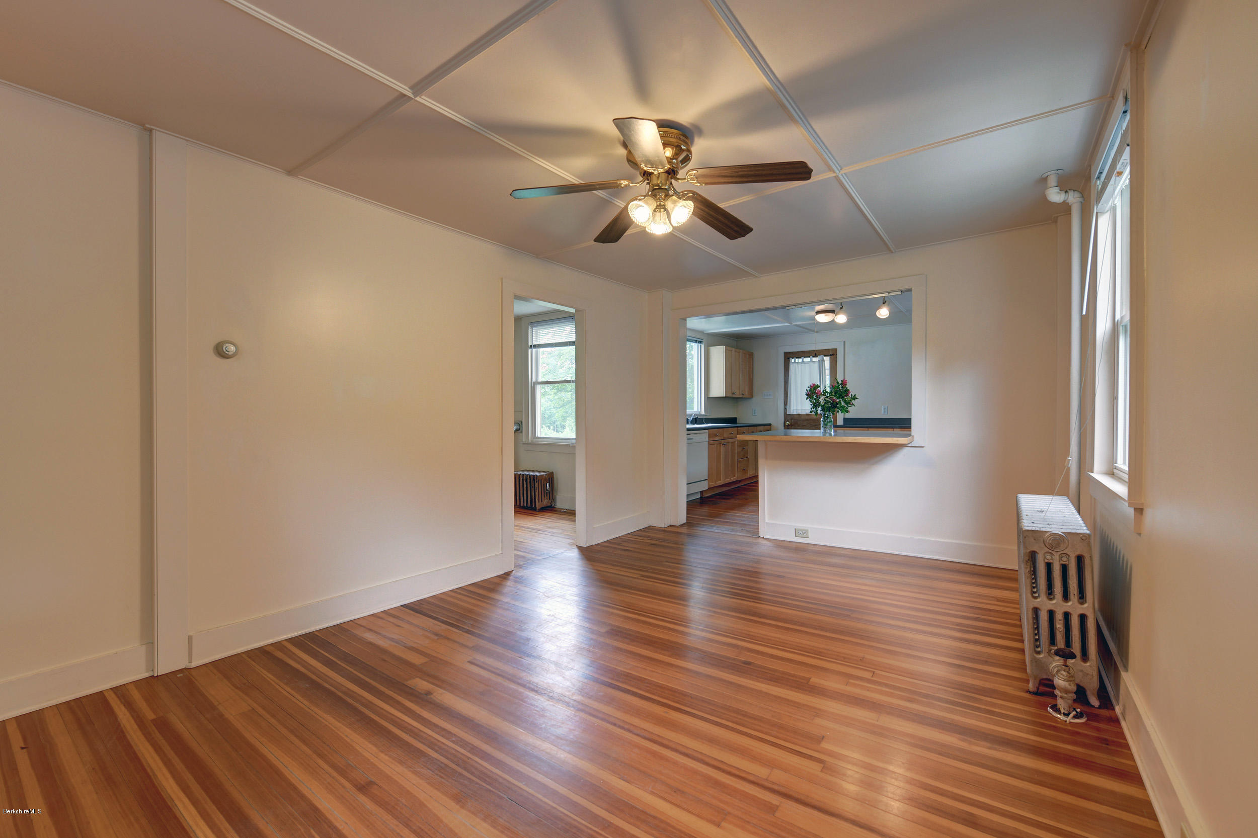 23 Glendale Road Stockbridge, MA 01262 - Photo 10 of 30 a view of a livingroom with wooden floor and a ceiling fan