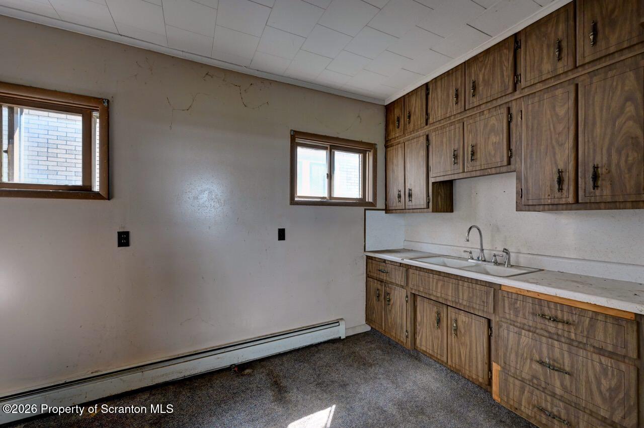 18 Green Ridge Street Scranton, PA 18509 - Photo 14 of 29 a kitchen with sink cabinets and window