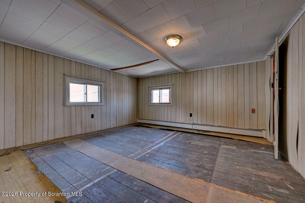 18 Green Ridge Street Scranton, PA 18509 - Photo 17 of 29 a view of an empty room and window and wooden floor