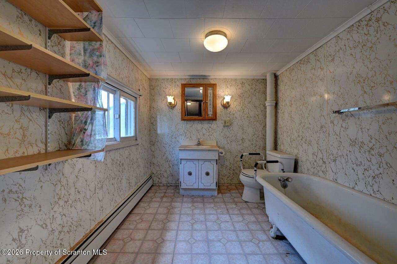18 Green Ridge Street Scranton, PA 18509 - Photo 21 of 29 a bathroom with a bathtub and a sink