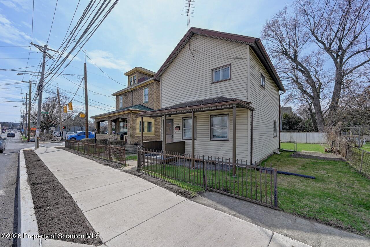 18 Green Ridge Street Scranton, PA 18509 - Photo 29 of 29 a view of a white house with a yard next to a road