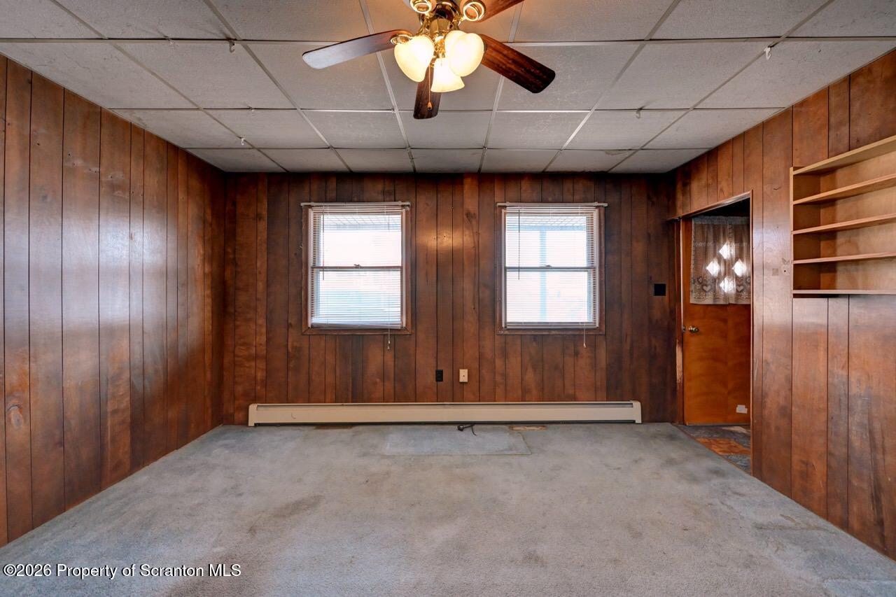 18 Green Ridge Street Scranton, PA 18509 - Photo 9 of 29 an empty room with windows chandelier fan and windows