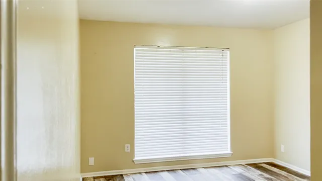 a view of a bedroom with a window