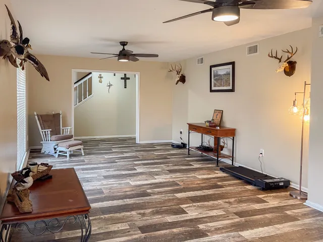 a room with gym equipment and a window