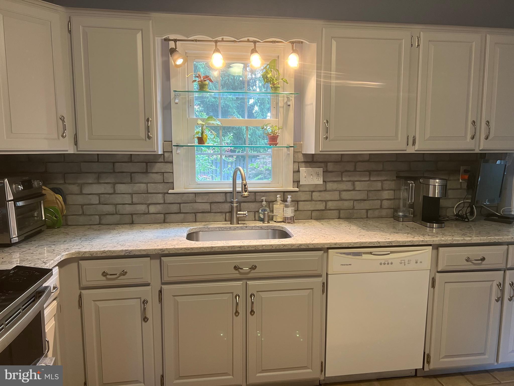 720 North Reeds Road Downingtown, PA 19335 - Photo 5 of 28 Stainless Sink below Terrarium Window