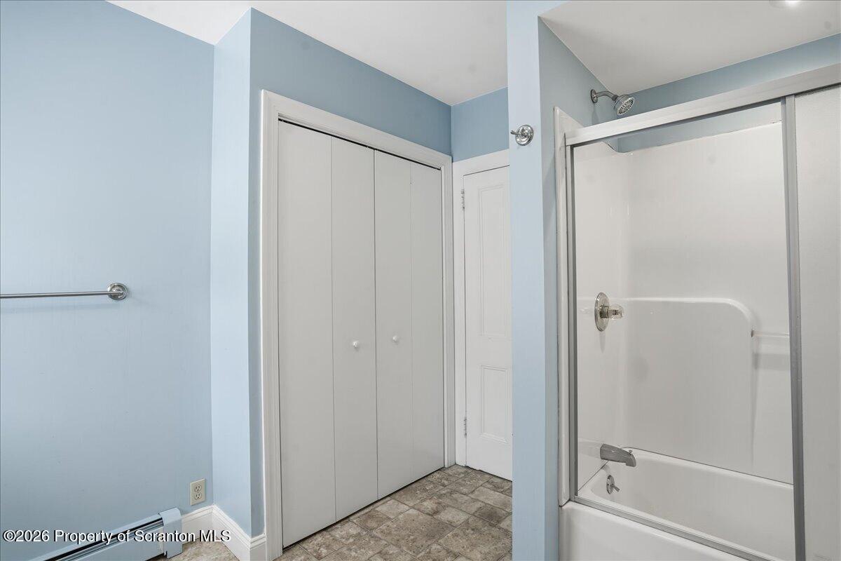 795 Wescott Road New Milford, PA 18834 - Photo 53 of 81 a bathroom with a glass shower door