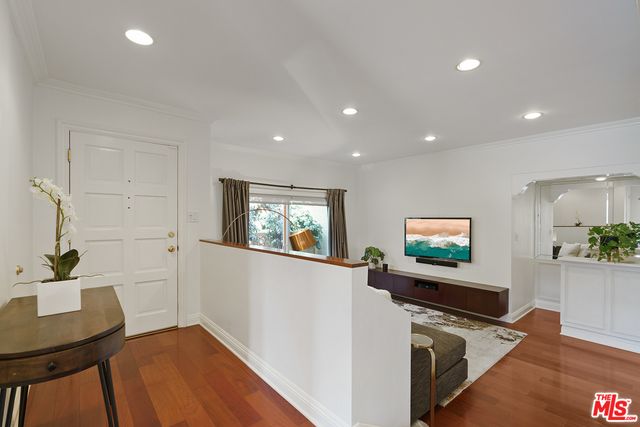 a living room with a couch and a flat screen tv